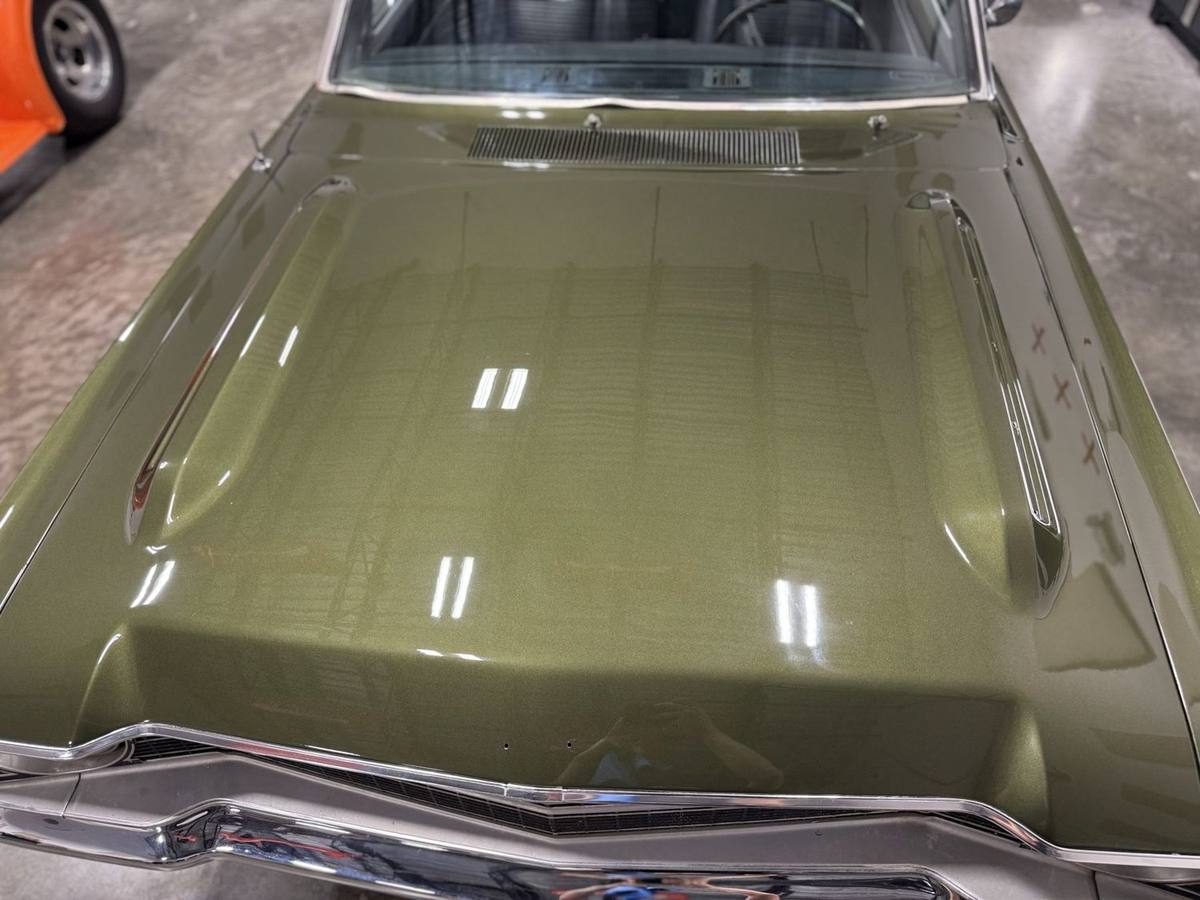 1969 Dodge Dart hood. Reflections in the corrected paint