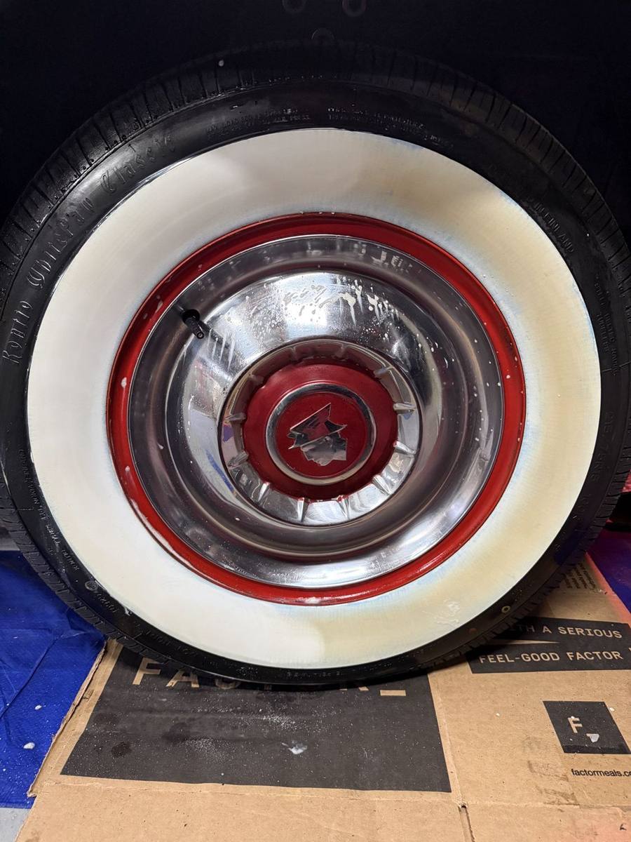 Whitewall tire, 50/50. Whitewall cleaned halfway to show the difference